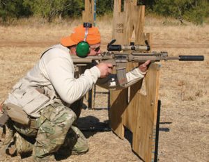 Student-shoots-barricade-kneeling