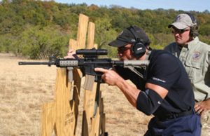 Student-shoots-from-barricade-as-Assistant-Instructor-John-Jackson-looks-on