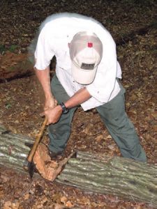 When-chopping-logs,-stand-behind-the-log,-legs-shoulder-width-part,-and-maintain-a-parallel-plane-with-the-cutting-bit