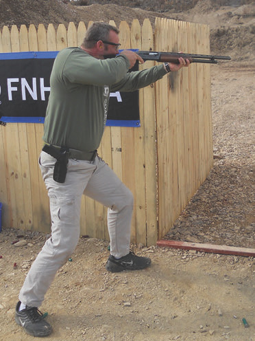 Mike Duskin uses fighting stance in competition. Even though Mike is 6' 7" tall, weighs 270 pounds and has no trouble manhandling the shotgun on target, he still takes the extra fraction of a second to get deep into a fighting stance. This results in an increased ability to settle the gun faster between shots. Less overall time engaging targets means a better score for that stage.