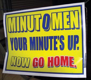 A-protestor’s-sign-used-during-one-of-the-Minutemen’s-operations