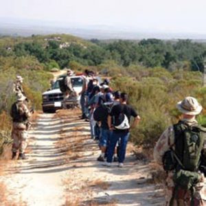 A-quiet-group-of-border-militiamen-turns-over-a-group-of-illegal-aliens-to-the-Border-Patrol