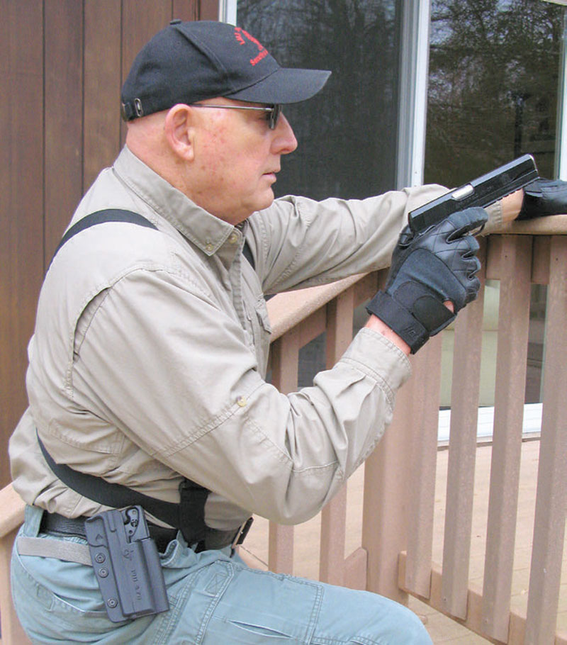 Author-negotiates-obstacle-with-sightless-Springfield-Armory-1911-and-Perry-Outback-system-with-Comp-Tac-holster