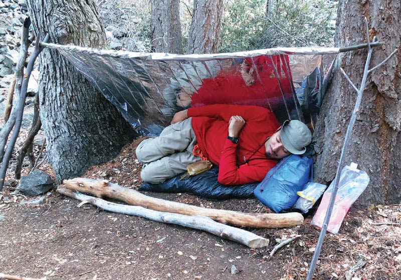 Author-uses-Mylar-space-blanket-as-his-shelter-during-overnight-stay-in-the-woods