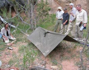 B.O.S.S.-instructor-Lori-Jonestrask-demonstrates-shelter-building-using-a-poncho