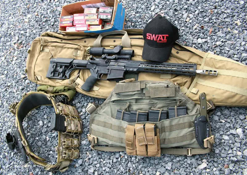 BlackHawk-drag-bag,-U.S.-PALM-chest-rig,-and-High-Speed-Gear-Patrol-belt-with-Taco-magazine-pouches-were-used-with-ArmaLite-AR-10-3-Gun