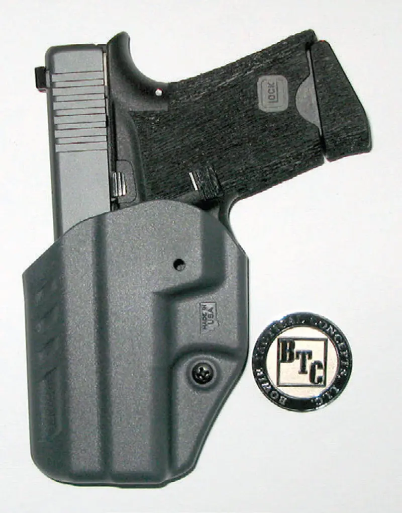 Bowie-G43-parked-in-very-slick-Blackhawk-ARC-IWB-holster,-showing-grip-reduction-and-stippling-and-Bowie-medallion