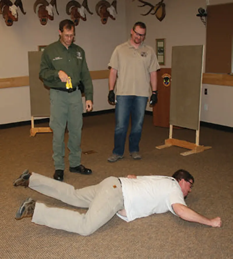 Deputy-James-Jenson-gets-a-dose-with-Salmon,-Idaho-Police-Officer-Isaiah-Day-watching