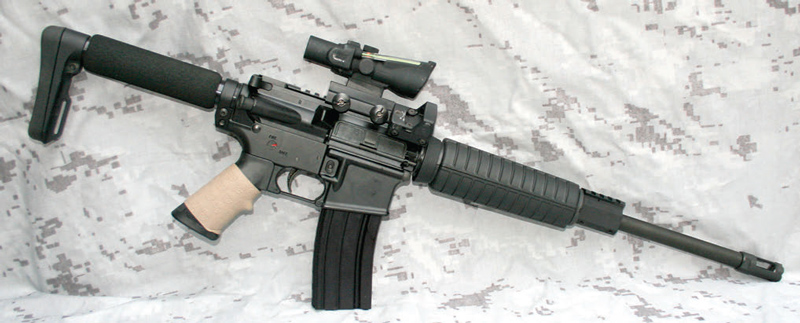 Doublestar-C3-based-.300-Blackout-carbine,-featuring-short-seven-inch-stock,-Tuff-1-grip-cover,-and-Trijicon-optics