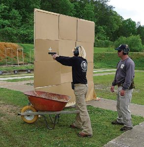 Firearms-instructor-and-Talon-Defense-owner-Chase-Jenkins-observes-author-during-training-session-on-the-range