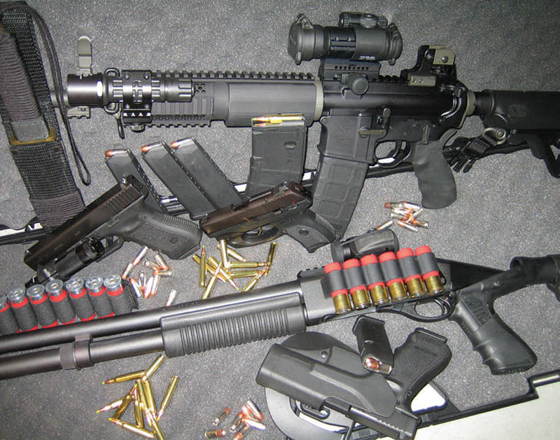 Golden-Trio-of-self-defense—semi-automatic-pistol,-12-gauge-shotgun,-and-carbine-chambered-in-5.56mm—with-adequate-supply-of-ammunition.