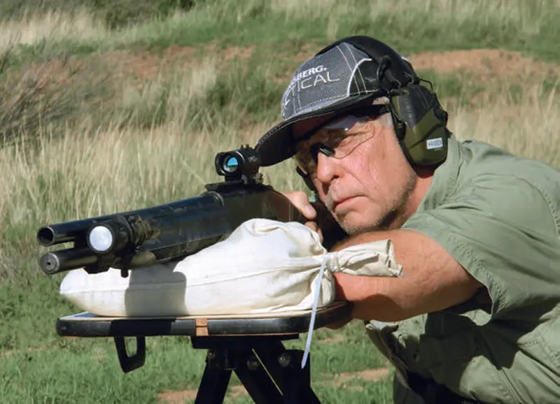 Hansen-tests-accuracy-of-slug-loads-from-the-bench-with-a-Sun-Optics-red-green-dot-sight