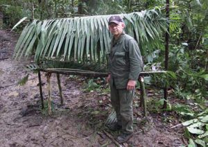 Hugh-Coffee-next-to-his-improvised-shelter-in-Amazon-jungle