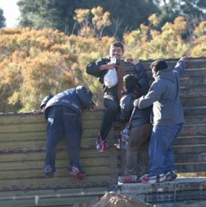 Illegal-aliens-running-back-across-the-Mexican-border-after-being-surprised-by-the-author-and-a-border-watch-group