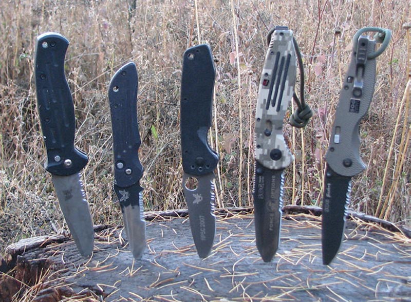 Left-to-right-Benchmade-automatics,-Balisong-folder,-SOG-Aegis,-and-Flash-Two.