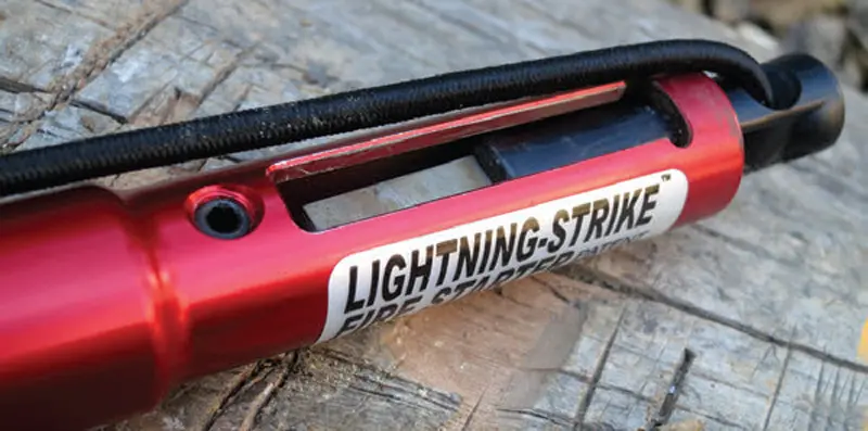 Lightning-Strike-Fire-Starter-comes-complete-with-a-metal-striker-that-is-attached-via-a-short-length-of-shock-cord