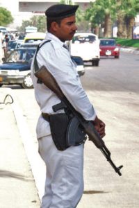 Officer-guards-a-convoy-outside-of-Cairo,-Egypt