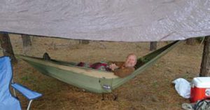 Tim-Phillips-relaxes-in-Eagles-Nest-Outfitters-Double-Nest-Hammock