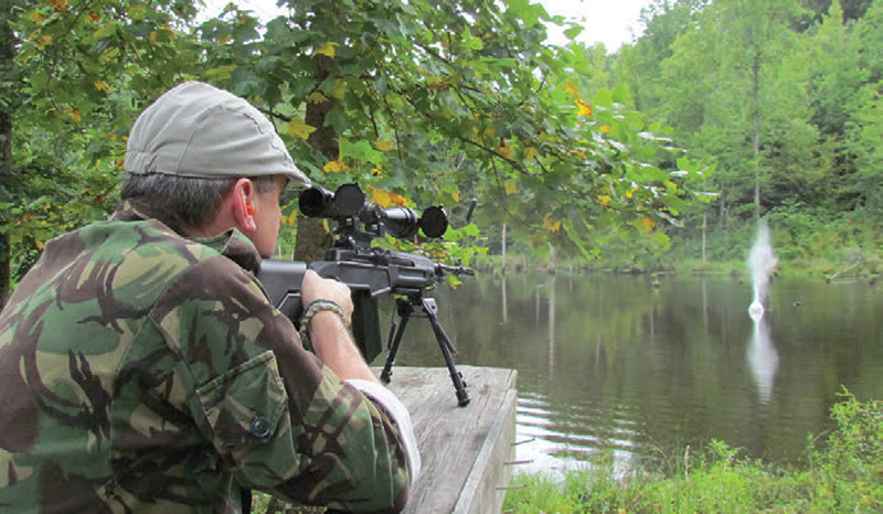 Tree-covered-65-foot-bluff-wrapped-like-an-amphitheater-around-a-farm-pond-creates-the-rare-shooting-area-where-it’s-safe-to-shoot-into-the-water