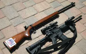 Two-extremes-Precision-Mossberg-.22-bolt-action-target-rifle-(top)-and-AR-15-with-BCM-upper