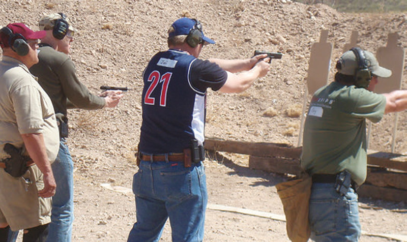 At-Tucson-shooting,-local-hero-and-armed-citizen-Joe-Zamudio-(center-in-blue-shirt)