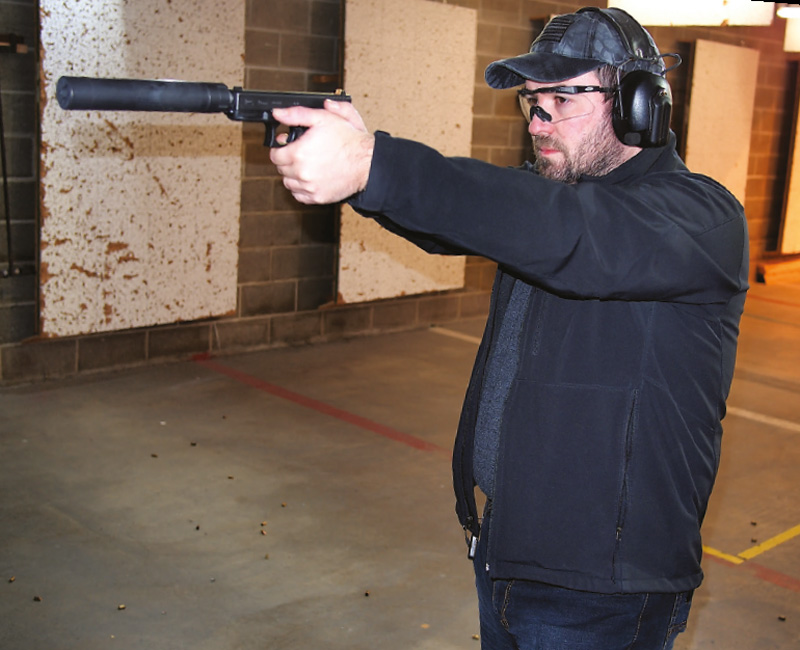 Author-shooting-his-Glock-19-equipped-with-an-Advanced-Armament-TiRant-9-suppressor