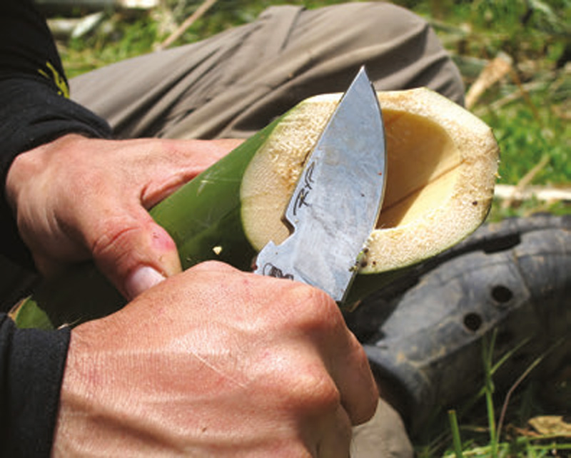 Author-uses-HEST-II-to-carve-away-sharp-edges-of-green-bamboo-for-a-drinking-cup