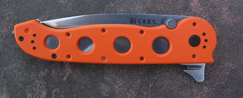 Both-glass-breaker-stud-(1)-and-seat-belt-cutter-(2)-can-be-used-with-blade-folded