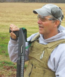 Instructor-demonstrates-fundamentals-of-ballistic-(shotgun)-breaching