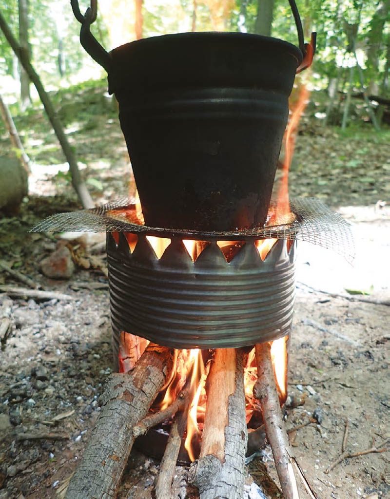 Kettle-or-pot-can-be-used-to-boil-on-top-of-hobo-stove-supported-by-wire-fencing-or-grill