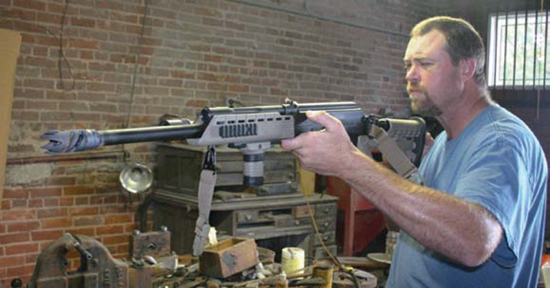 Kevin-Meier-examines-Saiga-12-after-installing-Warthog-muzzle-brake