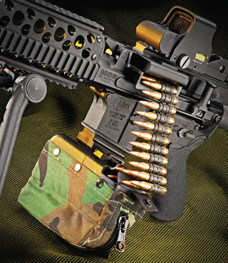 Magazine-adapter-in-magazine-well-and-attached-to-100-round-M249-ammo-pouch