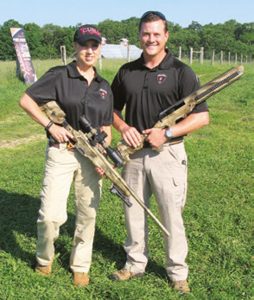 Melissa-Gilliland-cradles-Saber-Enhanced-Factory-Remington-700,-.22-250-caliber-rifle