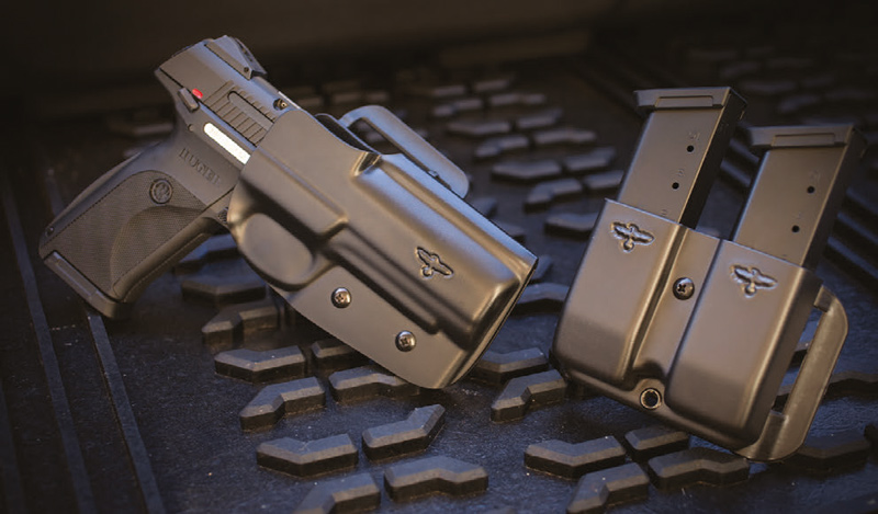 Ruger-SR45-pistol-and-two-spare-magazines-are-nicely-decked-out-in-Blade-Tech-molded-holster-with-Gunsite-Raven