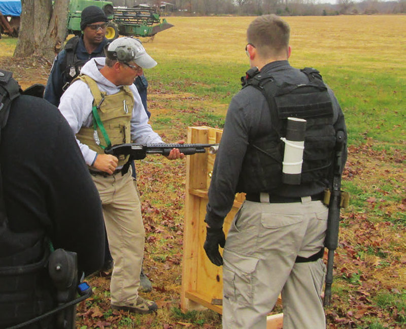 Students-at-shotgun-breaching-faзade-learn-basic-manipulation-of-the-shotgun-in-breaching-mode