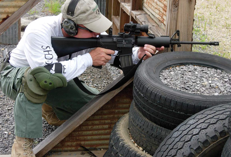 Tiger-McKee-on-the-Wall-with-his-concept-rifle