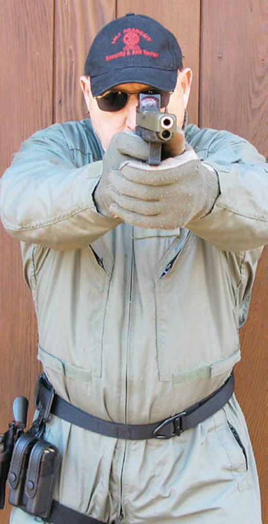 With-both-eyes-open,-author-demonstrates-two-handed-standing-shooting-stance-with-BG34