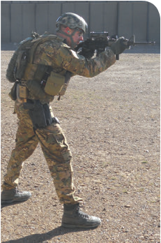 Support hand as far forward as it can go on a carbine rail, with the elbow down in a natural bent position and thumb on top of rail forming a C (being a lefty, a backward C in author’s case). Note aggressive stance to drive the gun and minimize recoil. If he wanted to, author could take his firing hand off the grip and the rifle would be fully supported, with little movement to the rifle.