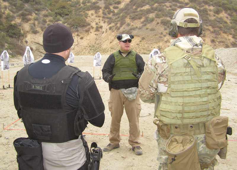 CQB-Tactics-Instructor-student-delivers-safety-briefing-before-executing-room-clearing-exercise