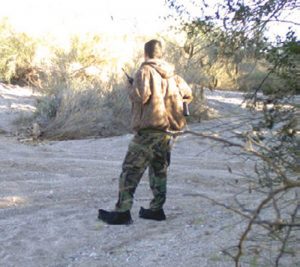 Cartel-lookout-caught-on-trail-camera-checking-his-area