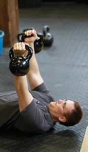 Detective-Bret-Nystrom-of-the-Crystal-Lake,-Illinois-PD-performs-perfect-double-kettlebell-press