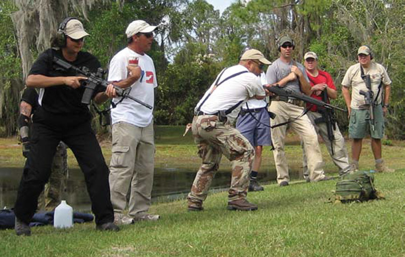 Shooters-wait-for-command-to-go-to-prone-in-shoot-off-drill-at-100-yard-line