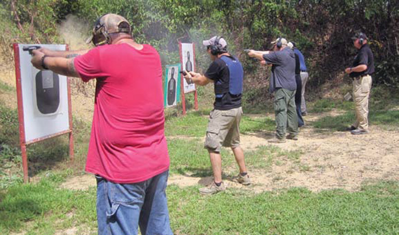 Students-fire-drill-under-watchful-eye-of-instructor-Tom-Givens