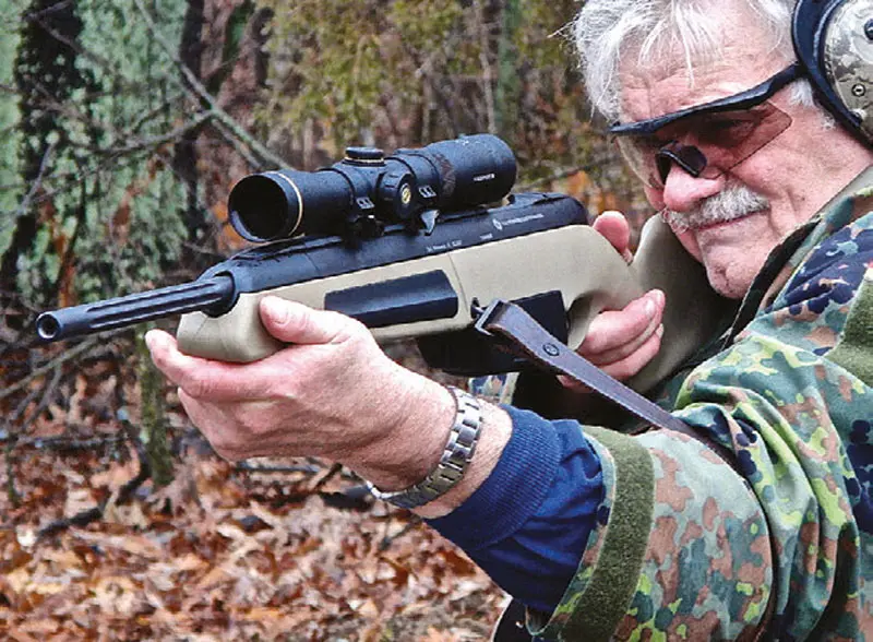 Thompson-shoots-Steyr-Scout-Tactical-with-low-mounted-Leupold-Scout-Scope