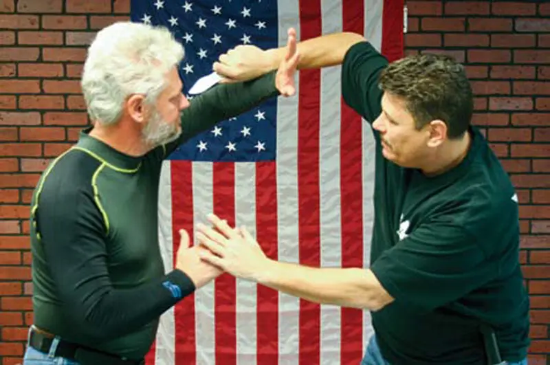 Tom-Sotis-(right)-demonstrates-technique-at-Amok-Personal-Combatives-class