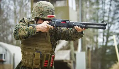 U.S.-Marine-wearing-two-Tactical-Stripper-units-while-firing-M1014-shotgun